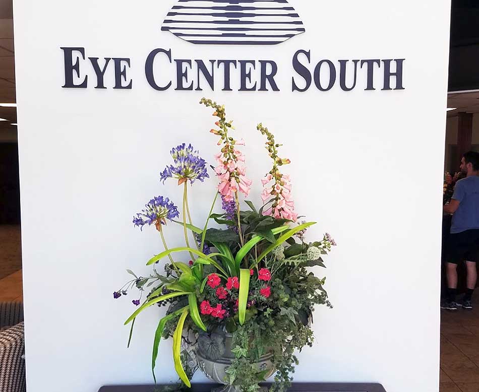 The logo and interior of Eye Center South, which is also Hearing Center South